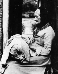 A Lace Maker Outside Her Cottage in South Buckinghamshire
